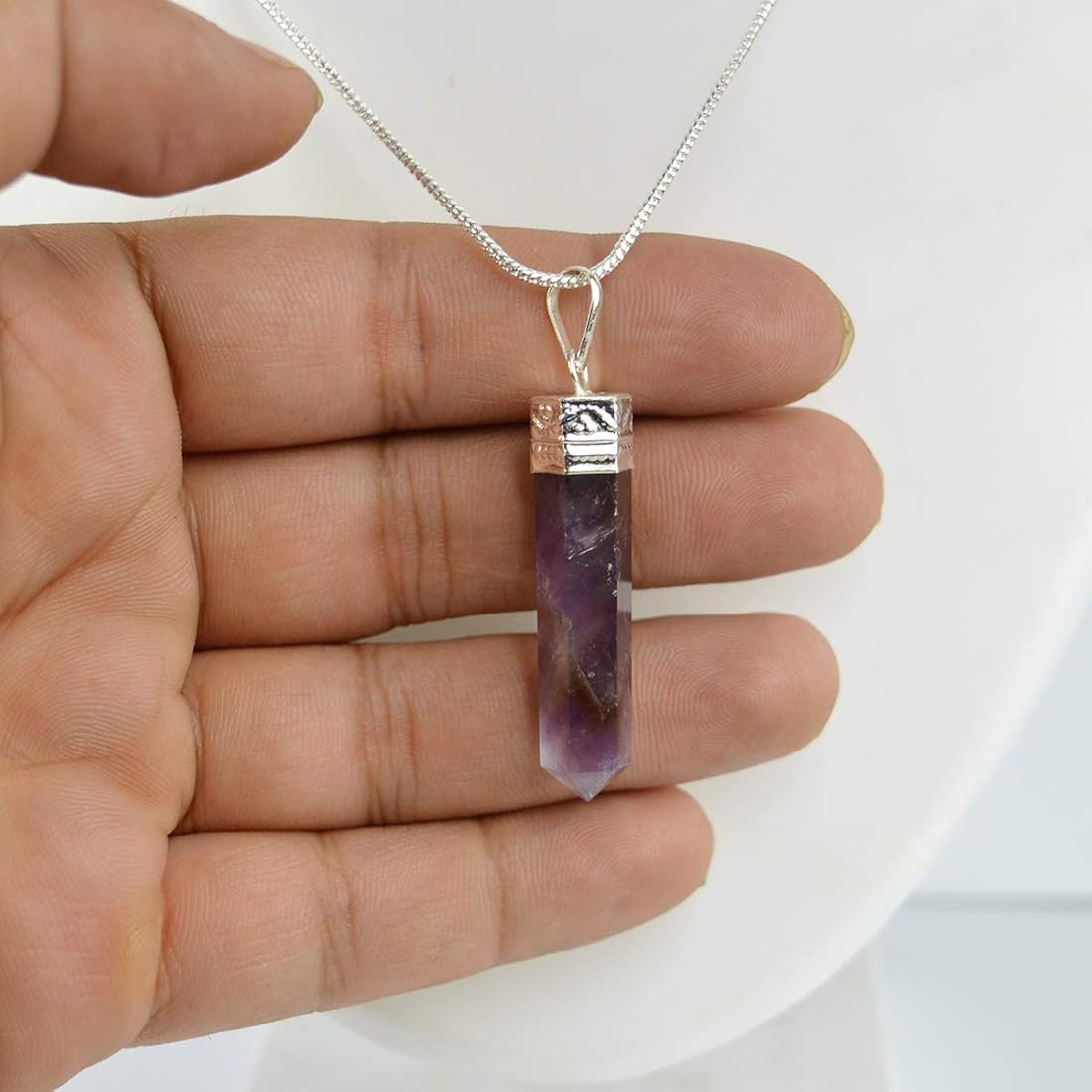 lakshya gems Genuine Amethyst pencil pendant featuring deep purple hues and a decorative silver bail.