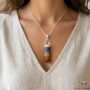 Natural Seven Chakra pencil pendant featuring seven layers of colorful healing gemstones.