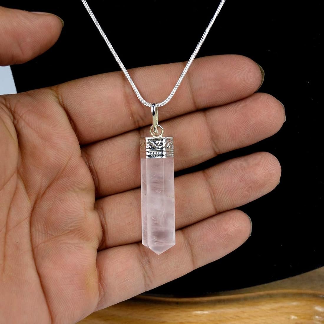 Natural Rose Quartz pencil pendant with soft pink translucent color and silver-toned bail. lakshya gems