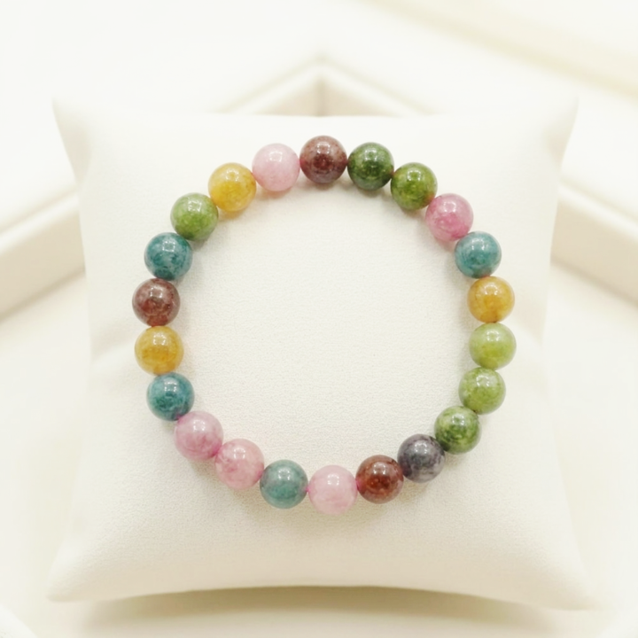 A natural Multi Tourmaline bracelet featuring a colorful mix of transparent pink, green, yellow, and black beads.