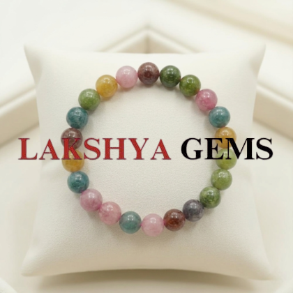 A natural Multi Tourmaline bracelet featuring a colorful mix of transparent pink, green, yellow, and black beads.
