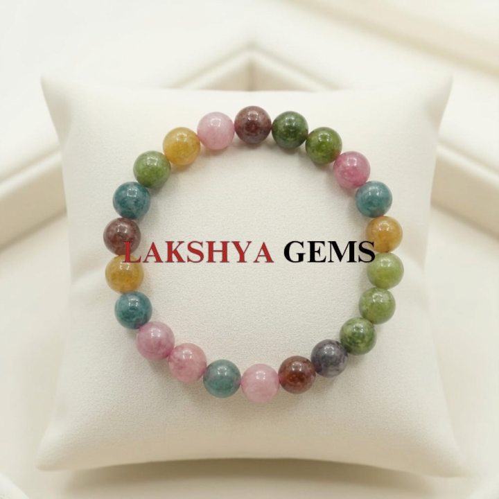 A natural Multi Tourmaline bracelet featuring a colorful mix of transparent pink, green, yellow, and black beads.