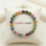 A natural Multi Tourmaline bracelet featuring a colorful mix of transparent pink, green, yellow, and black beads.