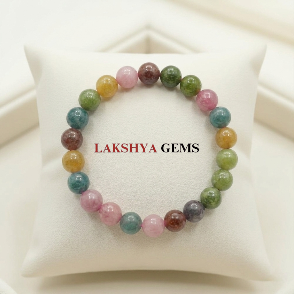 A natural Multi Tourmaline bracelet featuring a colorful mix of transparent pink, green, yellow, and black beads.