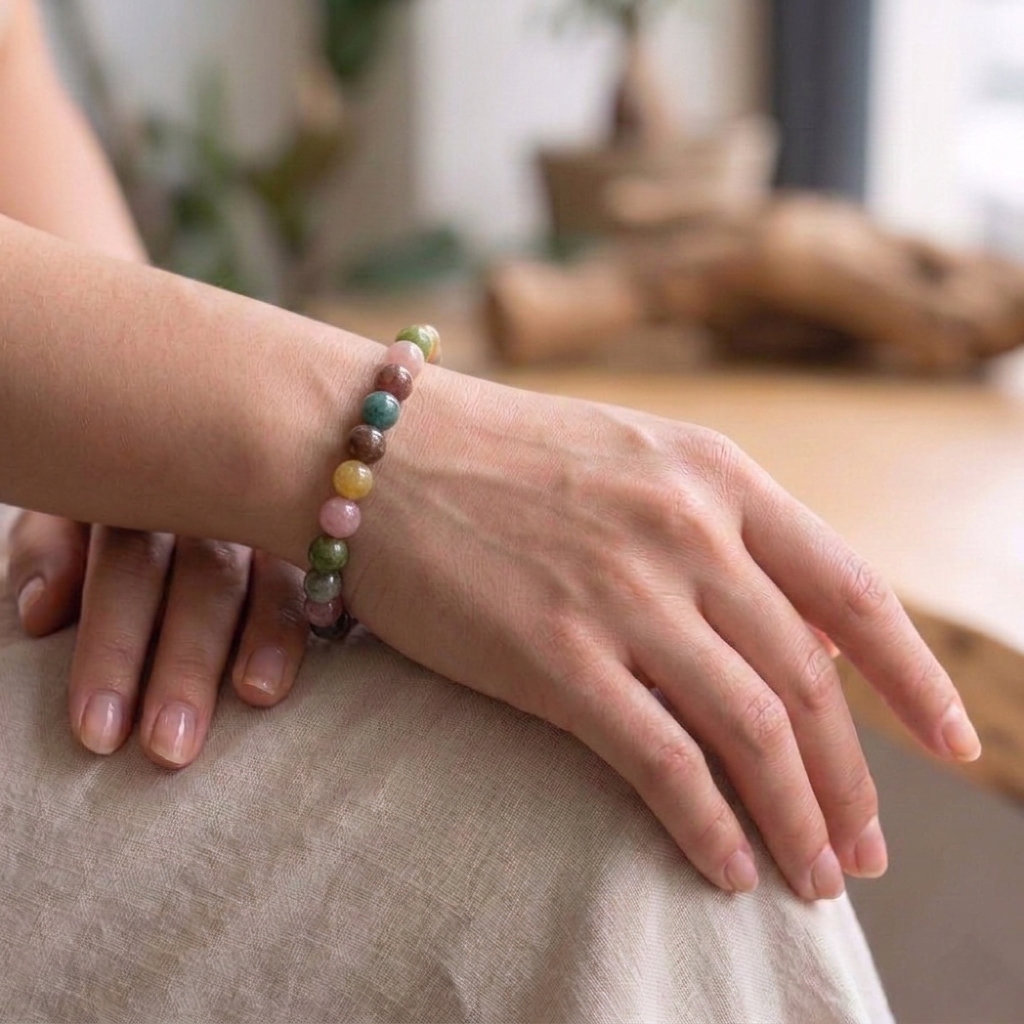 A natural Multi Tourmaline bracelet featuring a colorful mix of transparent pink, green, yellow, and black beads.