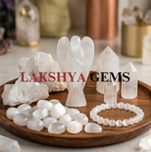 Selenite Crystal Angel from Lakshya Gems Mumbai A hand-carved natural Selenite crystal angel featuring a pearlescent white glow and polished finish.