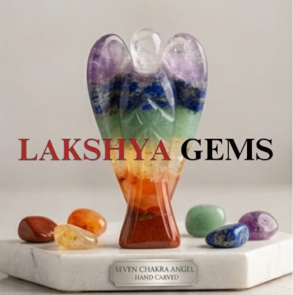 A hand-bonded Seven Chakra crystal angel featuring layers of natural red, orange, yellow, green, blue, indigo,