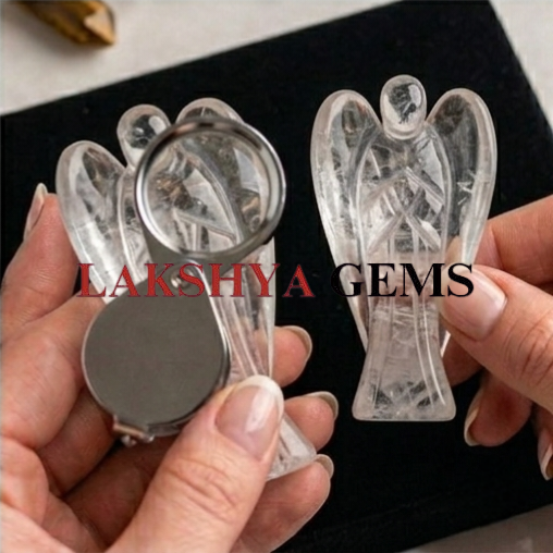 A hand-carved natural Clear Quartz crystal angel featuring high transparency and a brilliant polished finish.