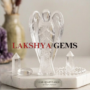 A hand-carved natural Clear Quartz crystal angel featuring high transparency and a brilliant polished finish.