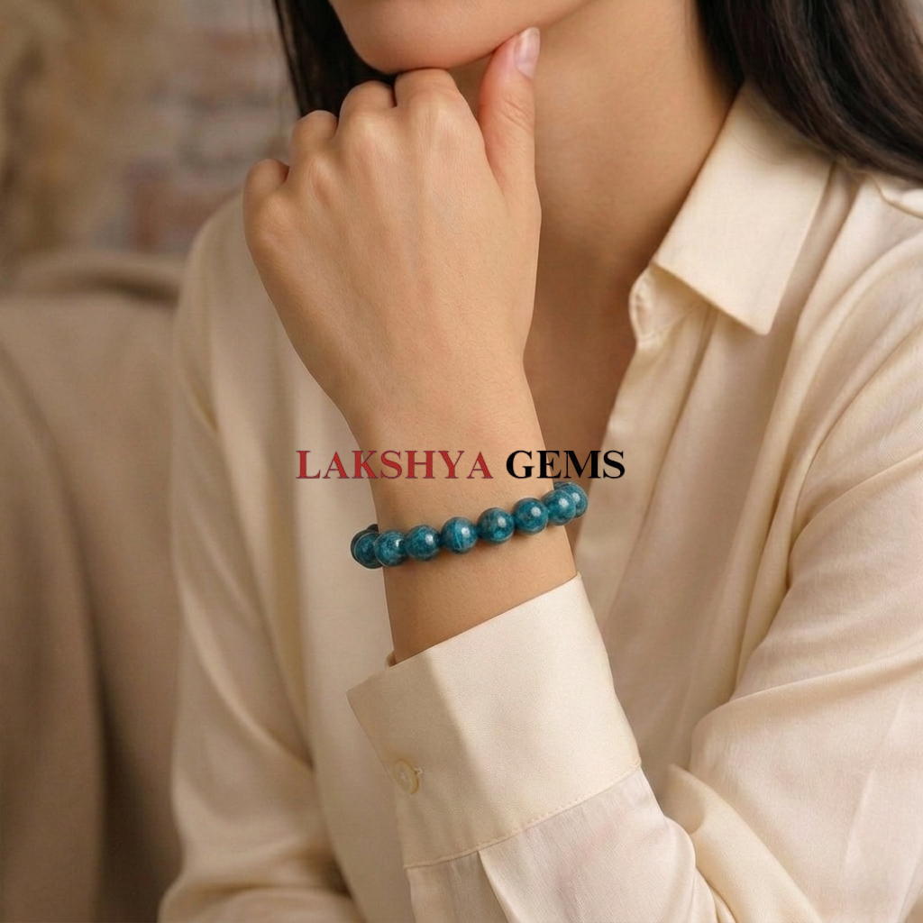 Blue Apatite Crystal Bracelet A natural Blue Apatite healing bracelet featuring round indigo-blue beads with a slight silky luster.