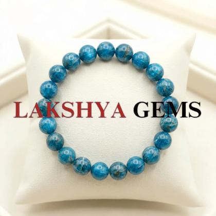 A natural Blue Apatite healing bracelet featuring round indigo-blue beads with a slight silky luster.