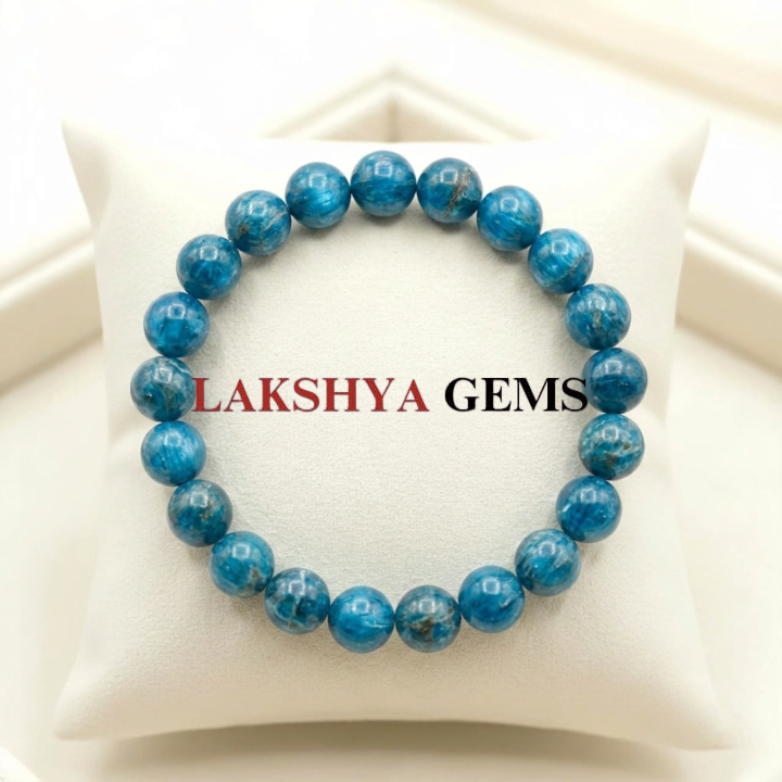 A natural Blue Apatite healing bracelet featuring round indigo-blue beads with a slight silky luster.
