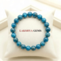 A natural Blue Apatite healing bracelet featuring round indigo-blue beads with a slight silky luster.