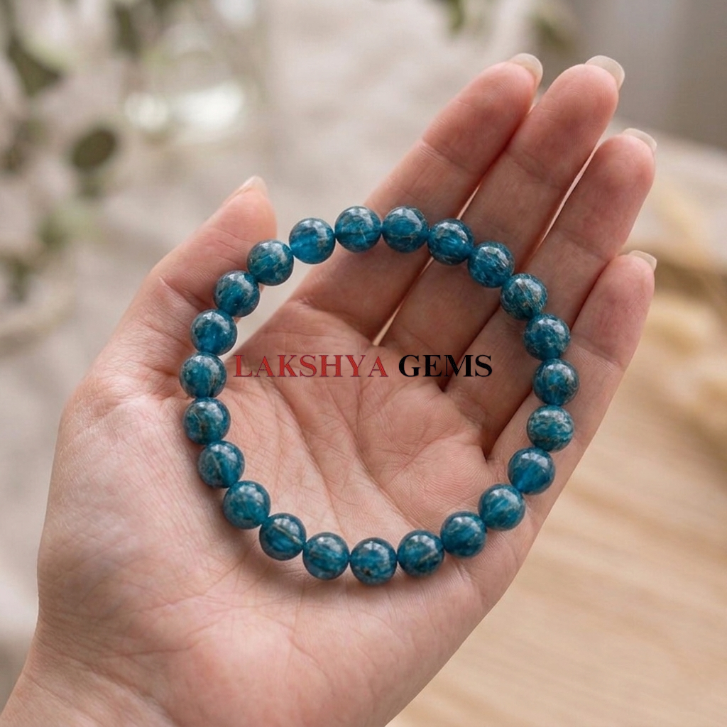 Blue Apatite Crystal Bracelet A natural Blue Apatite healing bracelet featuring round indigo-blue beads with a slight silky luster.
