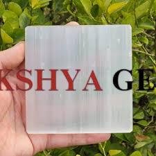 A square-shaped natural Selenite charging plate with a smooth, pearlescent white surface for cleansing crystals.